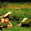 Russian soldiers taking a nap on a grass