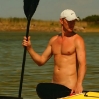Margus nude behind kayak