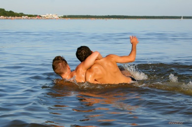 Anton and Ali playing in water