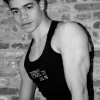 Steven by a brick wall, black and white