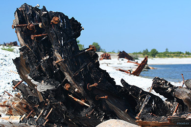 Burned ship wreck on beach of Pakri island