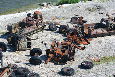 Parade of military vehicle wrecks on Pakri island
