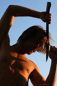 Alens cutting hair with machete
