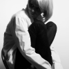 Aiki crouching on chair